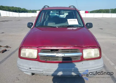 1999 Chevrolet Tracker from USA, damaged, VIN 2CNBJ13C8X6932848